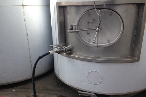 using superheated dry steam vapour to sanitise filtration tanks, followed by a thermal shock with a cold water rinse